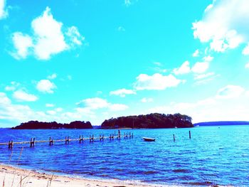 Scenic view of sea against cloudy sky