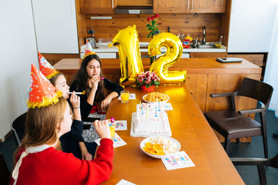 Girls enjoying birthday party at home