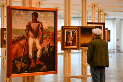 Rear view of couple standing in museum