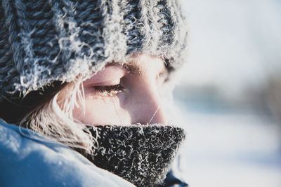 Close-up portrait of woman in snow