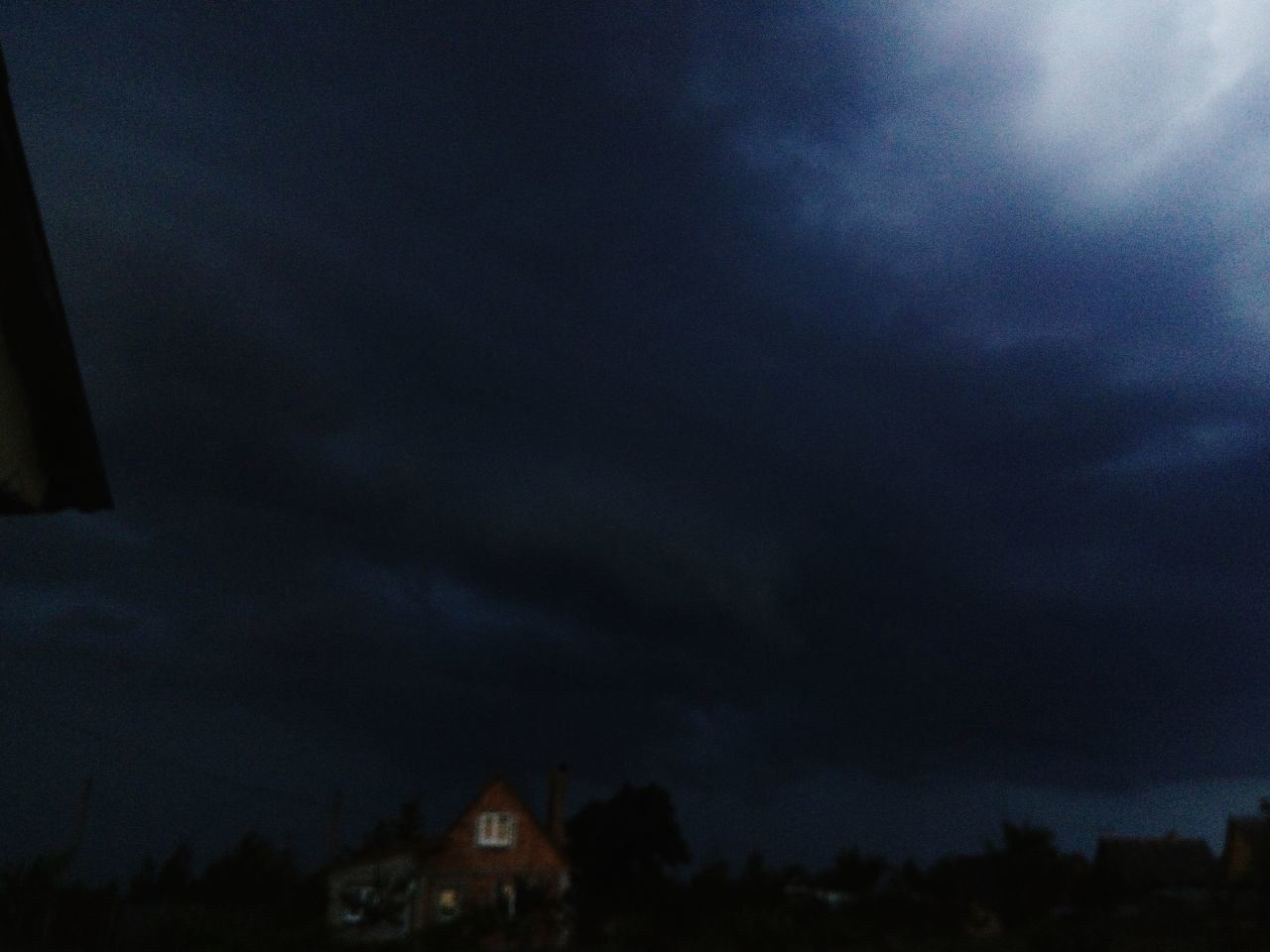 building exterior, built structure, architecture, sky, cloud - sky, night, house, no people, storm cloud, tree, silhouette, outdoors, nature, residential building, low angle view, illuminated, scenics, beauty in nature, city, thunderstorm