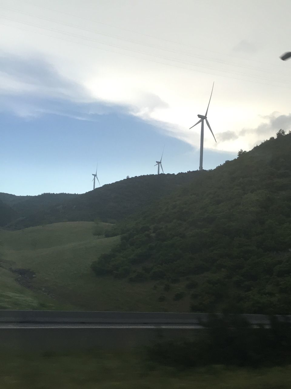 wind turbine, wind power, alternative energy, fuel and power generation, windmill, landscape, environmental conservation, renewable energy, sky, tranquil scene, mountain, tranquility, field, technology, rural scene, scenics, nature, non-urban scene, beauty in nature, cloud - sky