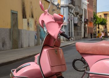 Close-up of pink motorcycle