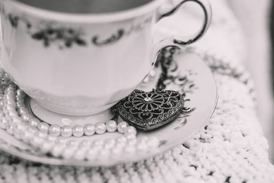 Close-up of wedding rings on table