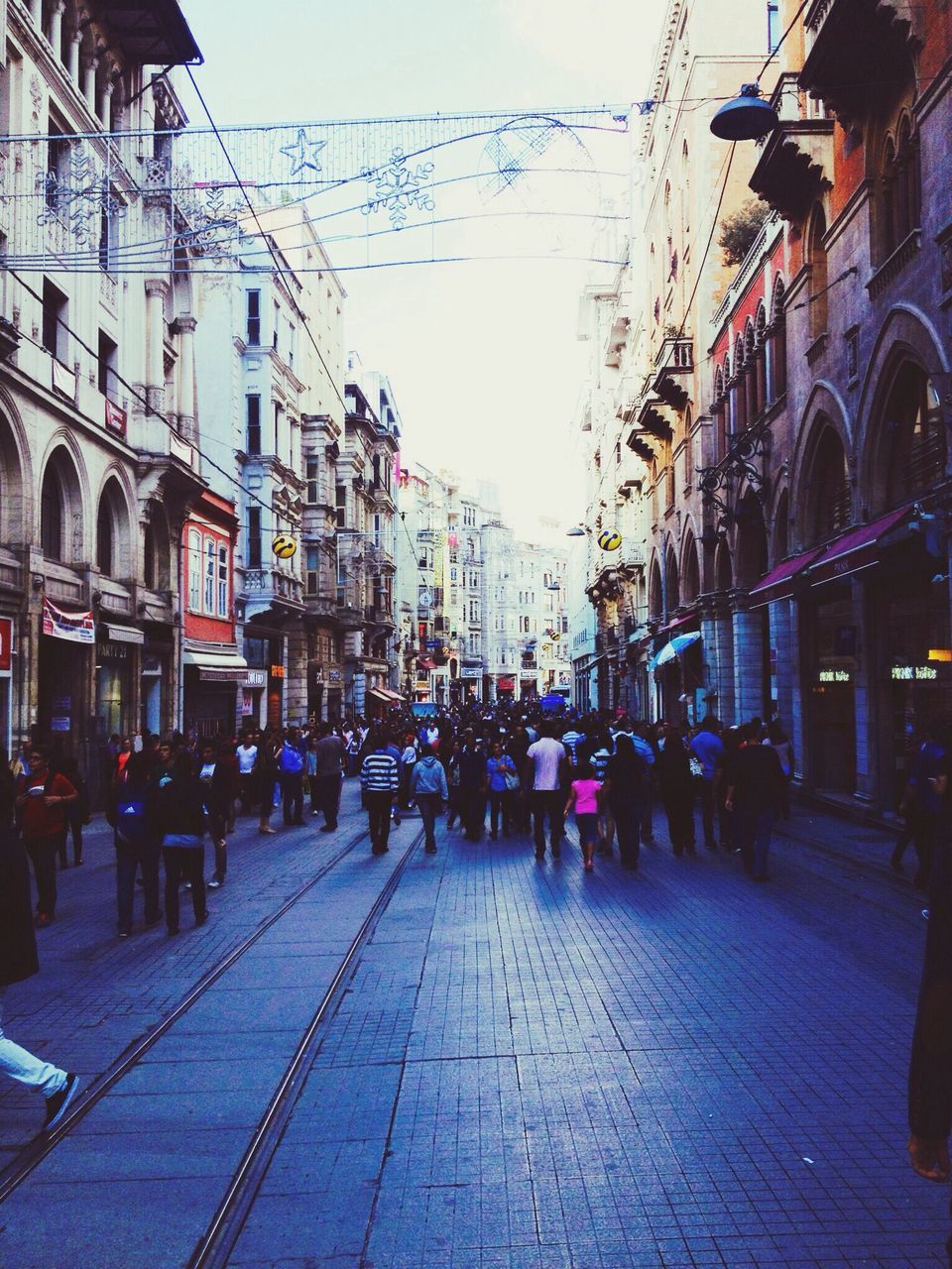 building exterior, architecture, built structure, street, large group of people, city, person, men, city life, walking, city street, lifestyles, building, residential structure, road, residential building, the way forward, sky, outdoors