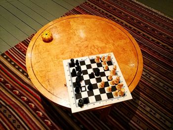 High angle view of chess pieces on table