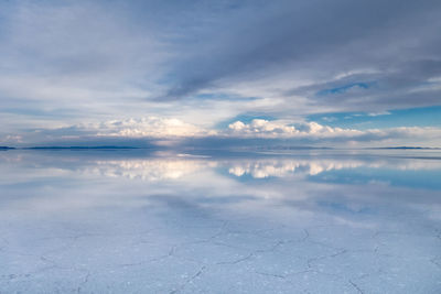 Scenic view of salt flat against sky