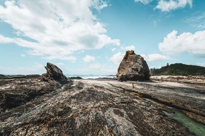 Panoramic view of rocks on beach against sky