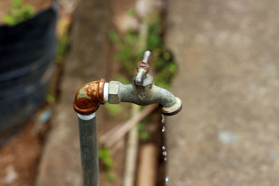 High angle view of pipe and faucet