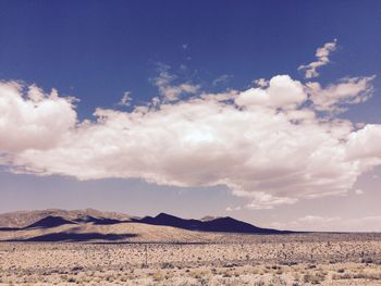 Scenic view of arid landscape against sky