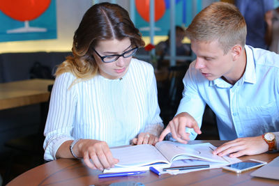 Colleagues working at table