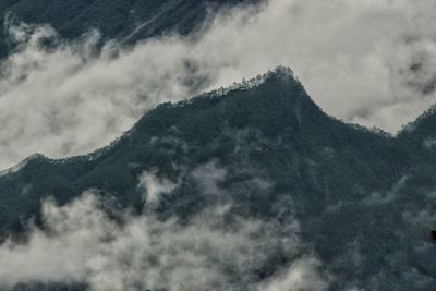 Low angle view of majestic mountains against sky