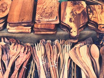 High angle view of cutting boards and wooden cutlery for sale in market