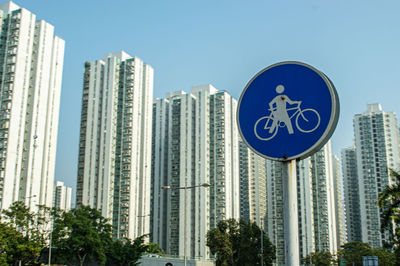 Low angle view of modern buildings against clear blue sky