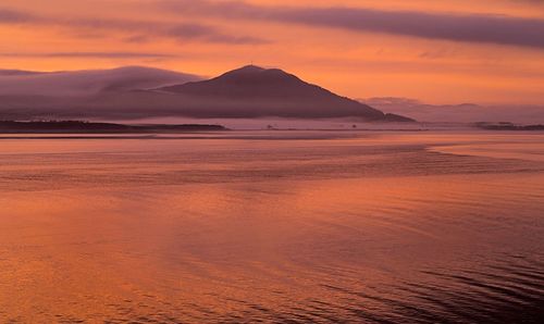 Scenic view of mountains at sunset