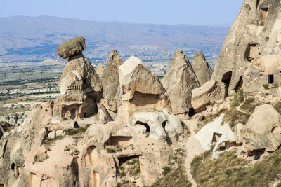 Panoramic view of rocks and mountains against sky