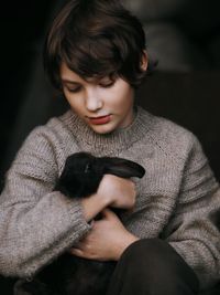 Portrait of young woman with dog