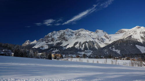 Scenic view of snowcapped mountains against sky