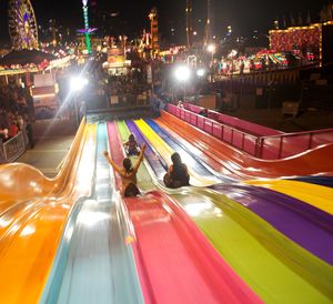 High angle view of people enjoying slide at park