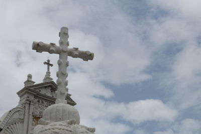 Low angle view of statue against sky