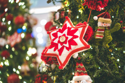 Close-up of christmas decorations hanging on tree