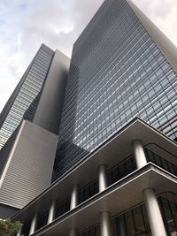 Low angle view of modern building against sky in city