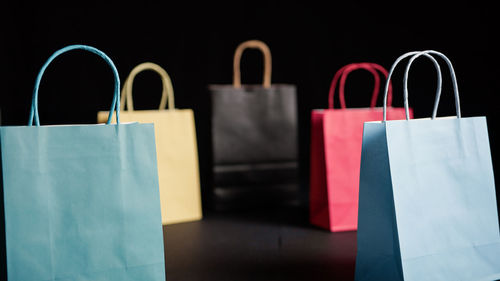 Close-up of shopping bags on table