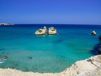 Scenic view of sea against clear blue sky