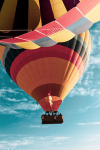 Low angle view of hot air balloon flying in sky