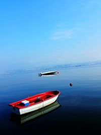 Nautical vessel on sea against sky