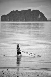 Rear view of woman looking at sea