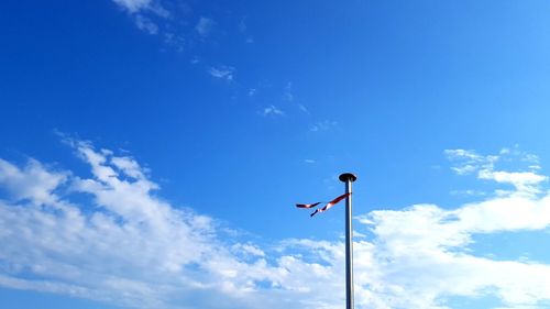 Low angle view of a pole against sky