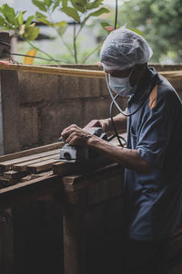 Man working on metal structure