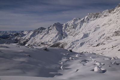 Scenic view of snowcapped mountains against sky