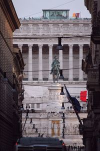 Low angle view of statues against sky