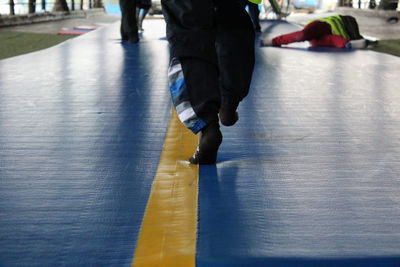 Low section of children playing on trampoline