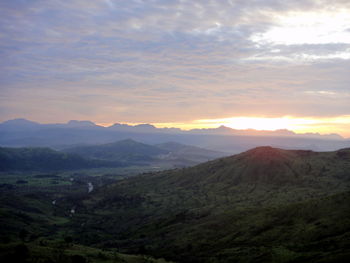 Scenic view of mountains against sky during sunset