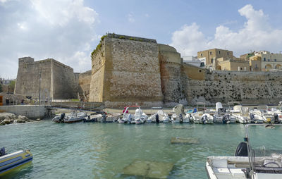 Boats in sea against sky