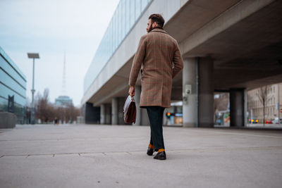 Businessman going to work by walk. commuting to the office. public transport