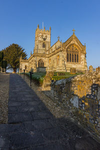 Low angle view of historical building against blue sky