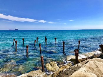 Scenic view of sea against blue sky