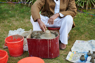 Low section of man working at workshop