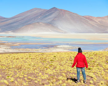 Rear view of man standing on mountain