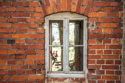 Close-up of window on brick wall