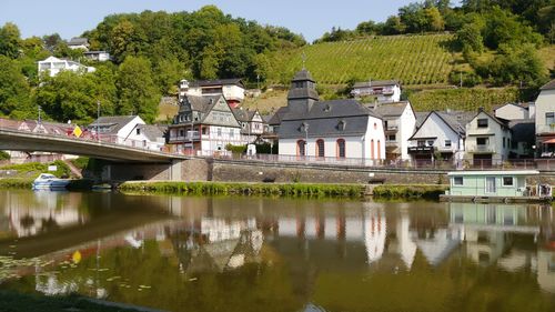 Reflections of cityview of small idyllic obernhof in lahn river