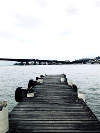 Pier over sea against sky