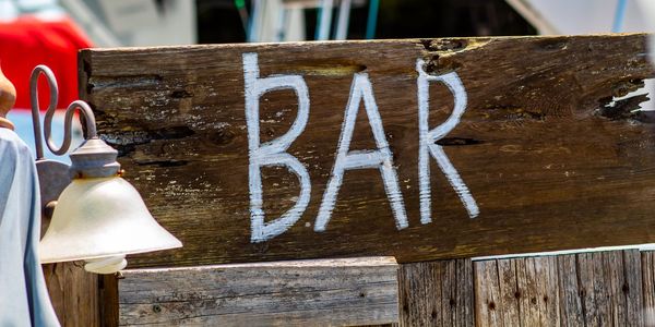 Close-up of text on wooden table