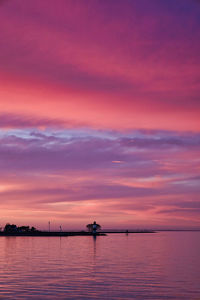 Scenic view of sea against orange sky