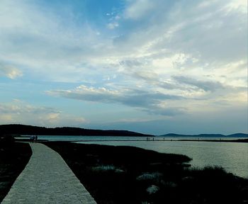 Scenic view of sea against cloudy sky