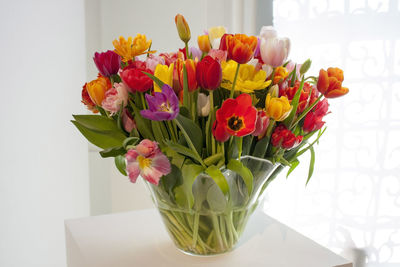 Close-up of tulips in vase on table